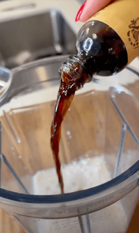 Vanilla being poured into a blender